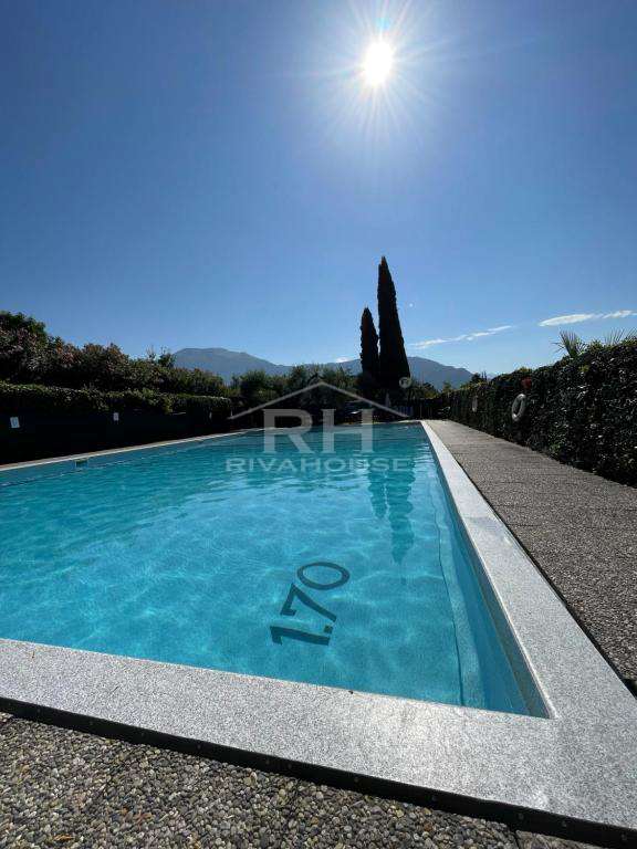 RIF. 01 - BILOCALE VISTA LAGO ESENTE GILMOZZI, CON PISCINA